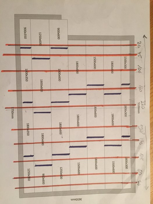 Blueprint with red lines indicating beams and purple lines for joints; dimensions marked on grid. Image is rotated incorrectly.