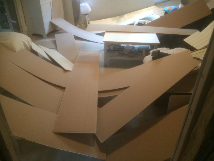 Collapsed ceiling panels scattered across a room, suggesting possible installation error with improperly spaced screws.