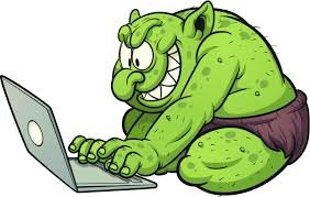Illustration av en grön tecknad troll som använder en bärbar dator.