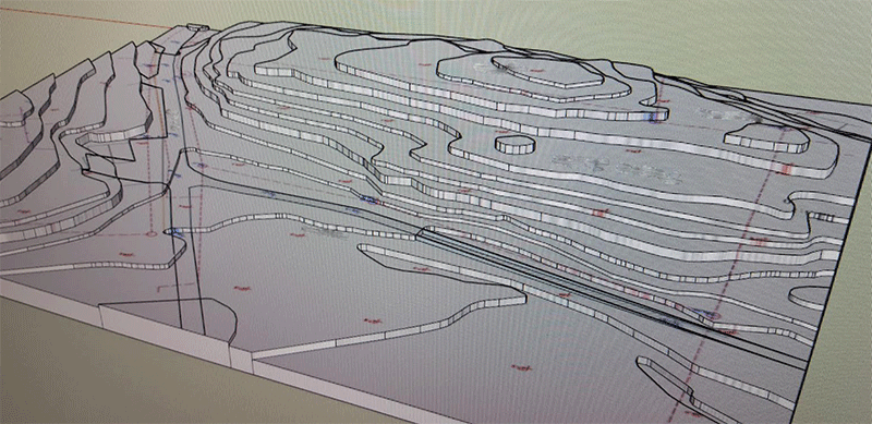 3D-terrängmodell i Sketchup med höjdkurvor, fotograferad från en datorskärm.