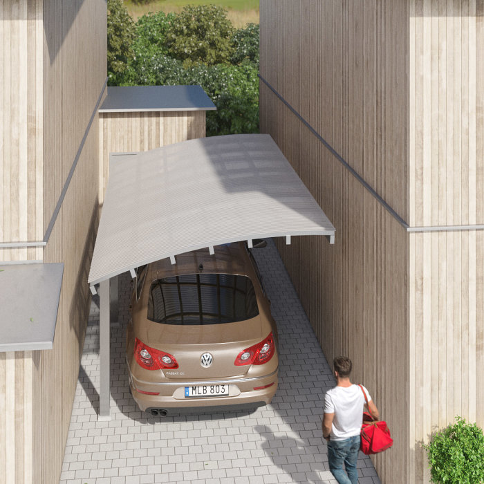 Översiktsbild av en beige bil under ett modernt, vitt skärmtak vid träklädda byggnader med en person nära bilen.