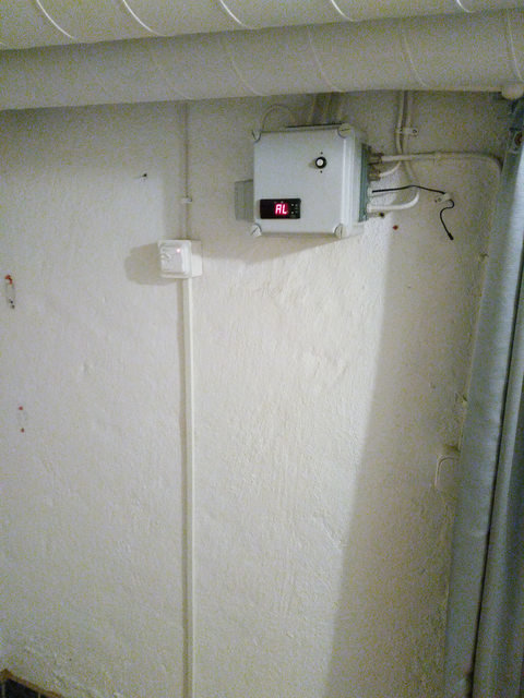 Mystery basement box with temperature display showing "AL", probe, and connected light switch.