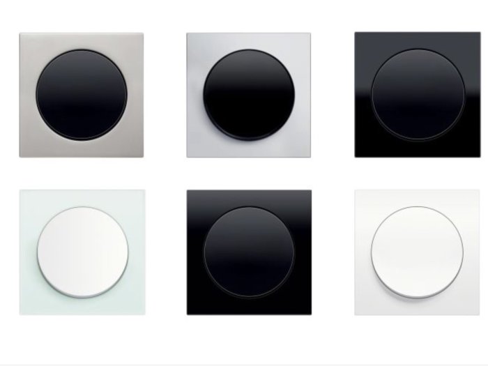 Nio olika väggmonterade ljusdimmerkontakter i olika kombinationer av svart och vitt.