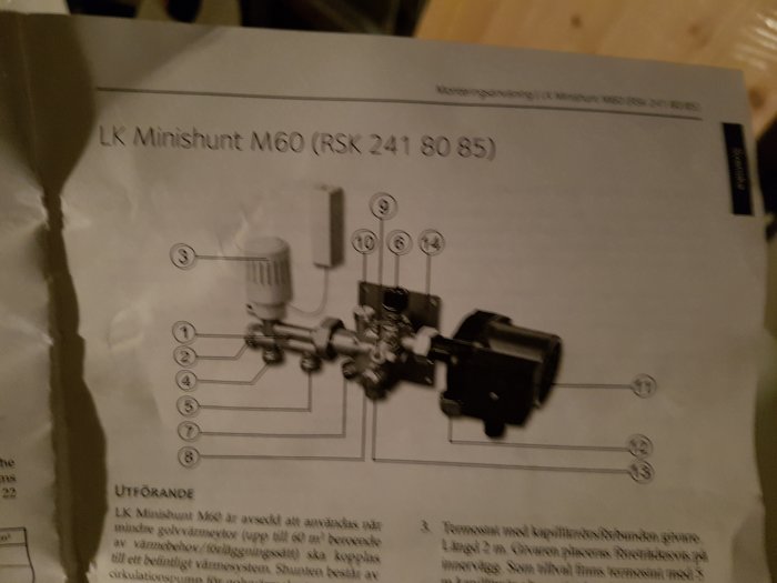 Suddig bild av en manual för LK Minishunt M60, innefattande diagram och instruktioner.