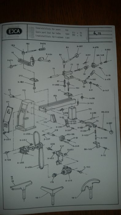 Exploded view diagram of lathe parts from an instruction manual with labels and part numbers.