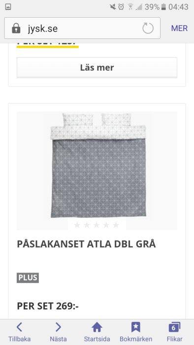 Mörkgrått och vitt påslakanset med geometriskt mönster, visat i en online butiksskärmbild.