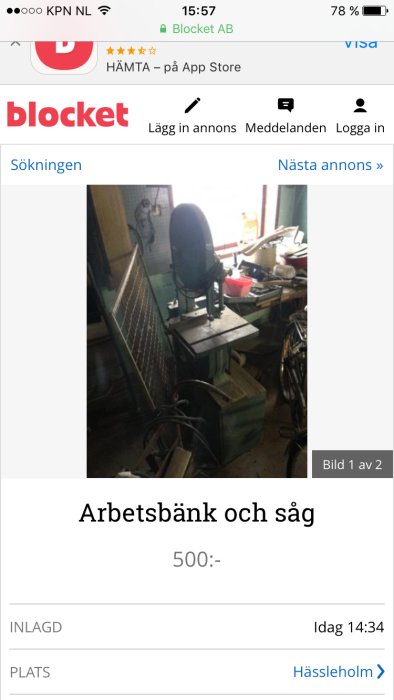 En Delta 14 bandsåg av tidig modell med oktagon stolpe, kallas Tauco i Sverige, i ett rörigt garage.