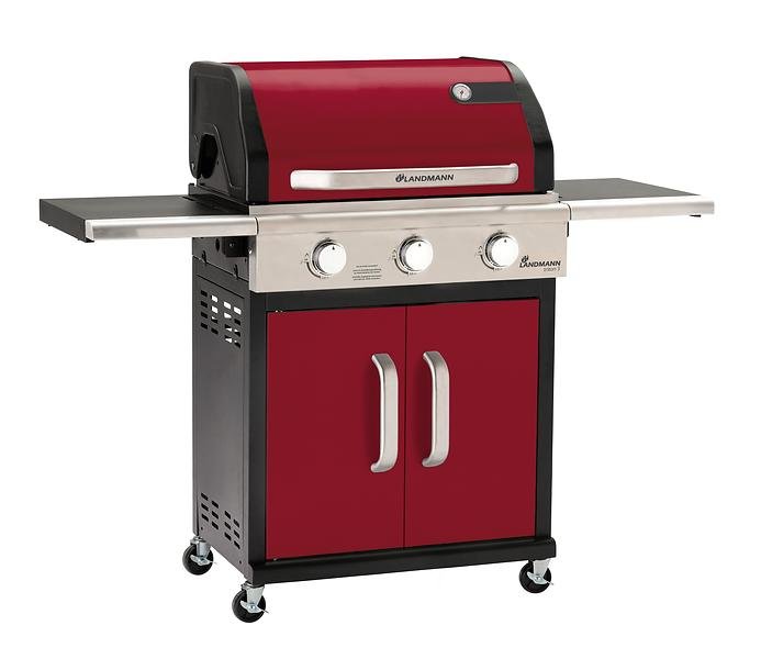 Röd och svart gasolgrill från Landmann med sidobord och förvaringsskåp.