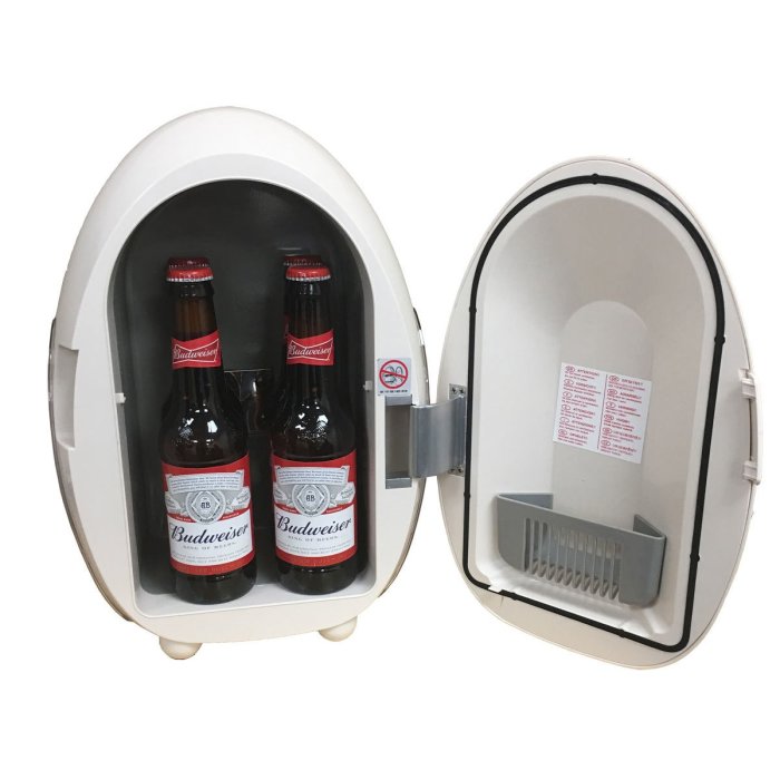 Portable mini fridge open with three Budweiser beer bottles inside.