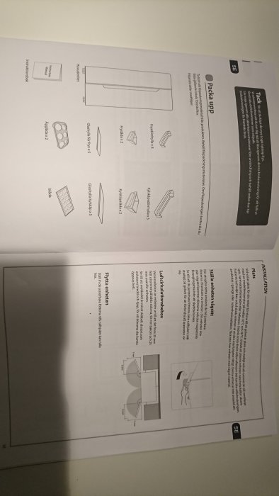 Instruktionsmanual öppnad på en sida som visar steg-för-steg illustrationer för installation av en produkt.