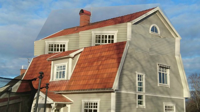 Digital manipulation of a house showing an unfinished gable roof extension with mismatched window scales.