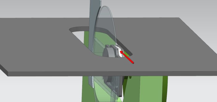 CAD-illustration av en såg med en säkerhetsriving knife mekanism enligt beskrivningen, synlig genom ett bordssåginsats.