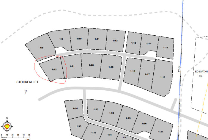 Detaljerad tomtkarta med markerad tomt 1:22 omgiven av andra numrerade tomter i ett planerat bostadsområde.