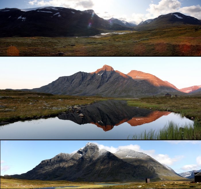 Utsikt över Sarek nationalpark med bergsspeglar i vatten och en fjällstuga vid kanten.