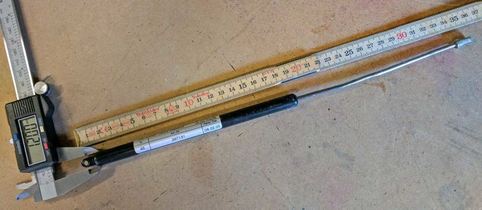 12mm yttre hylsa med måttstock och skjutmått, 350mm lång, vanliga öglor, styrka ~50N.