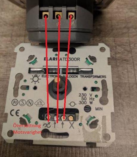 Elektronisk transformator för halogenlampor med markeringar som visar inställningar för översättning och motstånd.