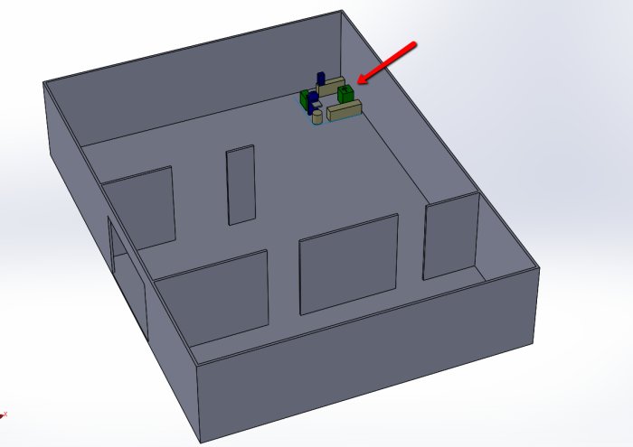 CAD-modell av byggnad med en oplacerad verkstadsutrustning markerad med en röd pil