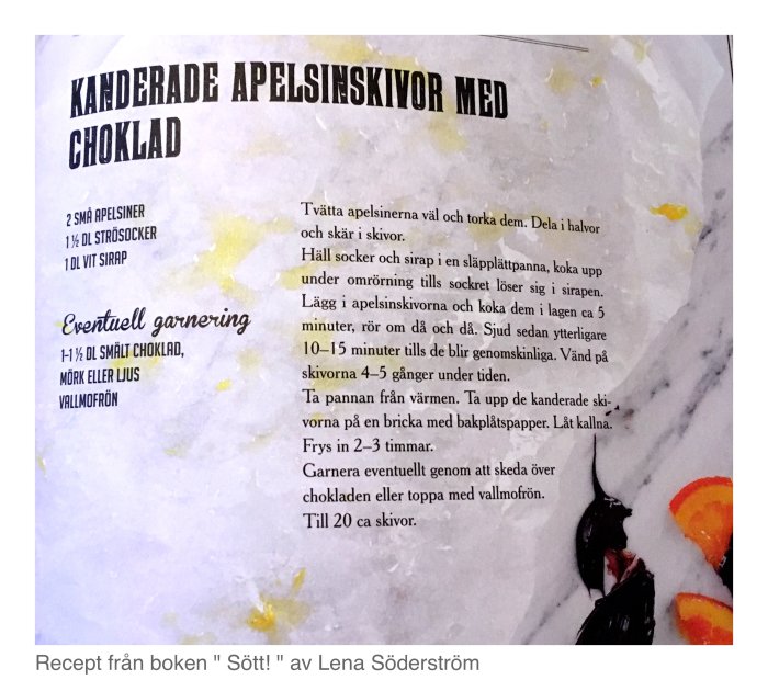 Recept på kanderade apelsinskivor med choklad och valfri garnering från en kokbok.