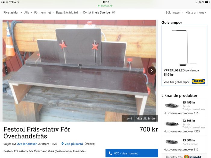 Hemmagjort frässtativ i trä med ritad Festool-logotyp på en bakgård.