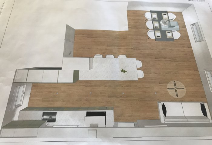 Översiktsritning av ett kök med en köksö, matplats och soffa, inklusive placering av skåp och apparater.