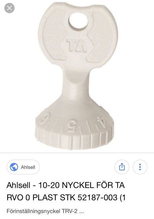 Plastnyckel för justering av ventil märkt med "TA" och skalanummer, troligtvis används för radiatorjustering.