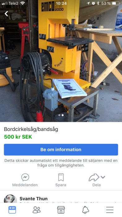 Gul bandsåg av märket EMCO 2000 till salu i ett garage, visas med tillbehör och instruktionsbok på bord.