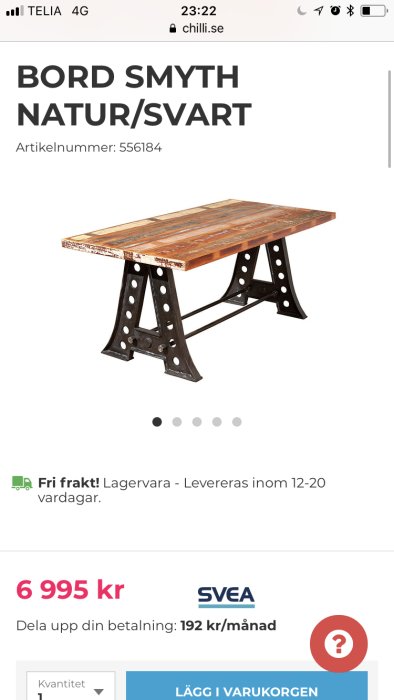 Rustikt industriellt bord med naturfärgad träskiva och svarta metallben.