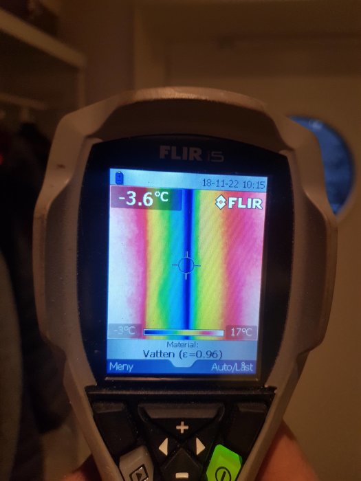 Thermographic image showing cold draft around a door at -3.6°C captured by a thermal camera.