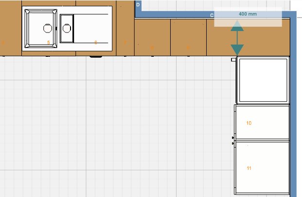 Planritning över ett kök med diskho, underskåp och plats för "tip out tray" under diskhon.