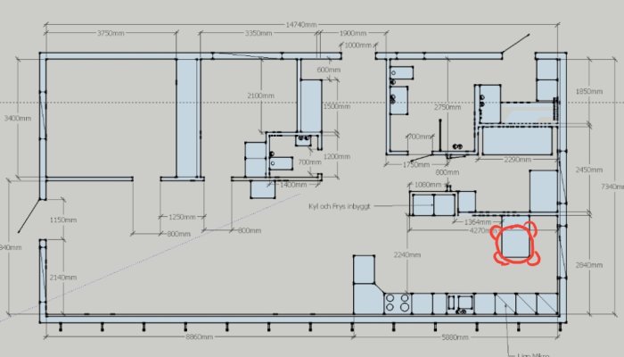 Ritning av kökslayout med måttangivelser och ett markerat område för ett runt bord.