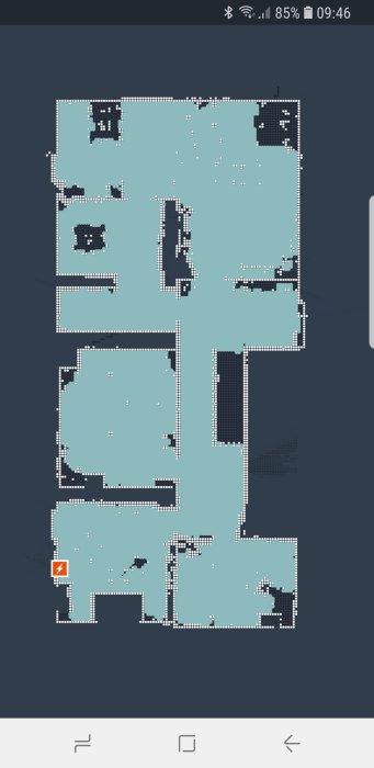 Skärmdump av en smartphone som visar en digital karta skapad av en dammsugarrobot, med synliga städpunkter och hinder.