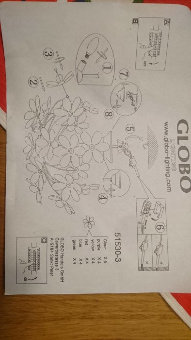 Instruktionsblad för montering av blomformad lampa med stegvisa anvisningar och elektrisk kopplingsschema.