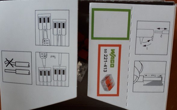 En förpackning för elinstallationsprodukter med instruktionsdiagram för anslutning av kablar.