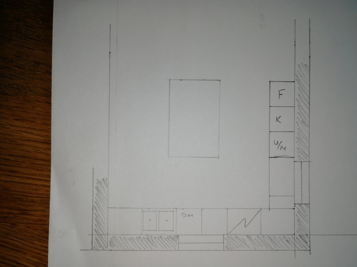 Handritad skiss av ett kökslayout med markeringar för en framtidig vinkel.