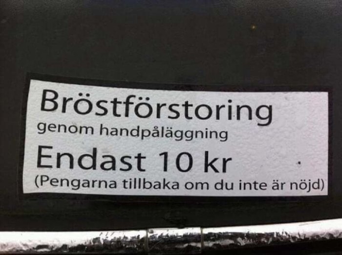 Skämtsam annons om bröstförstoring för 10 kr med handpåläggning och pengarna tillbaka-garanti.