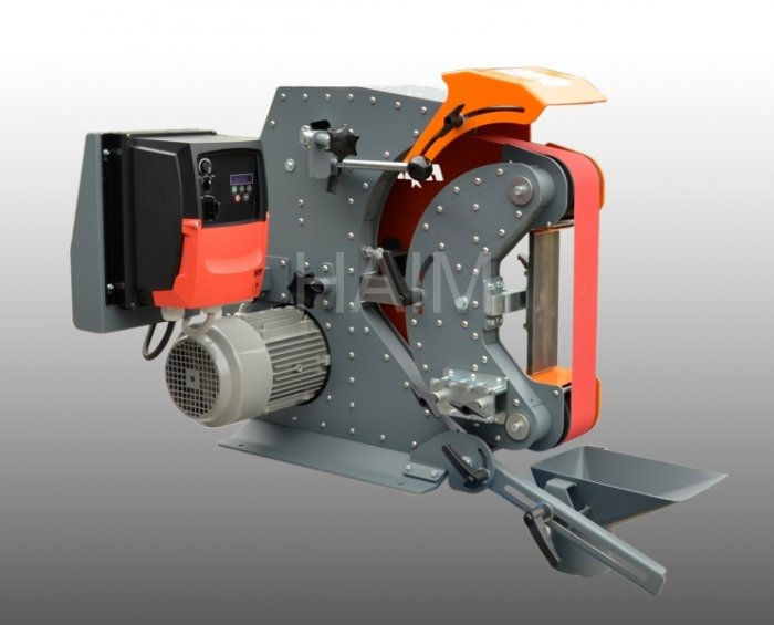 Industriell slipmaskin HAIM med orange och grå detaljer inklusive stort kontakthjul och kontrollpanel.