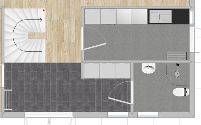 Planritning av en våning som visar förslag på förändring vid ingång, kök och tvättstuga.