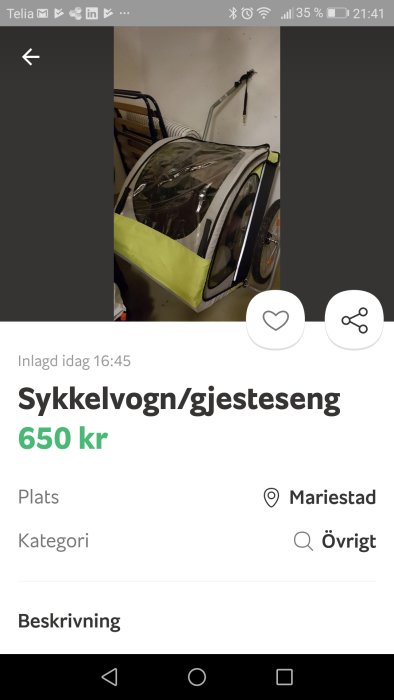Barnvagn ombyggd till cykelvagn och gästsäng i ett garage.