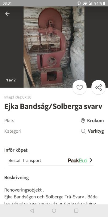 En begagnad Ejca bandsåg i en lada, med behov av renovering och komplett utrustning.