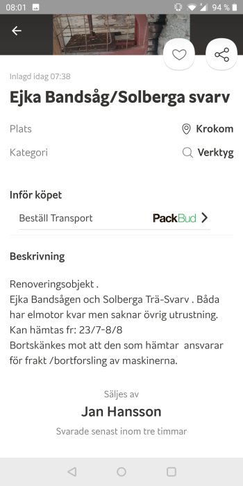 En äldre modell av Ejka bandsåg i ett garage, som erbjuds gratis med behov av upphämtning.