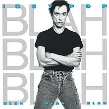 Omslagsbild för albumet med en man i svart T-shirt och blå jeans, omgiven av titeln "Blah Blah Blah" i blått.