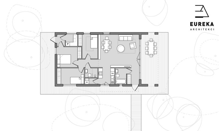 Planritning av ett hus med L-format kök, dold trappa mellan rum och plats för förvaring under trappan.