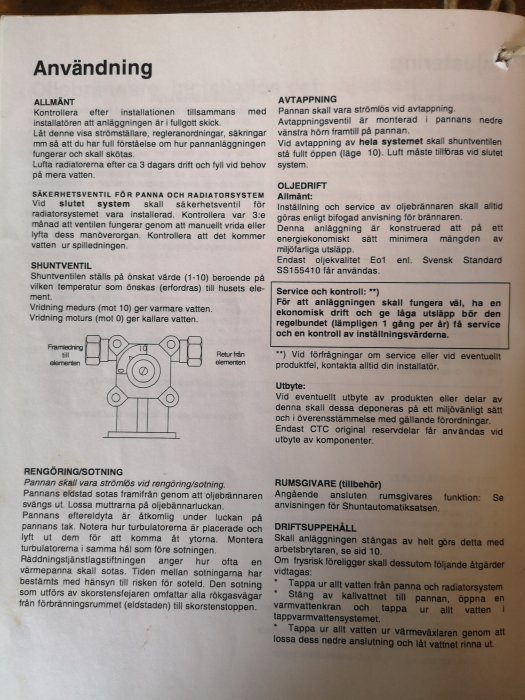 Fotografi av en handboksidan om användningen av en panna, med instruktioner för allmänt bruk, avtappning och rengöring/sotning.