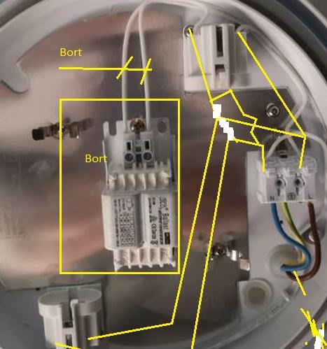 Inuti en elektrisk anordning med markerade ledningar och komponenter samt text som instruerar om borttagning.