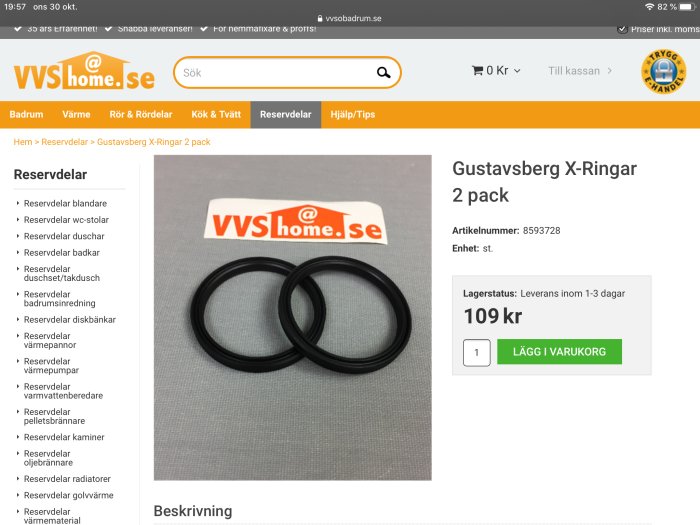 Två svarta X-ringar från Gustavsberg på en grå yta med en webbplats logo i bakgrunden.