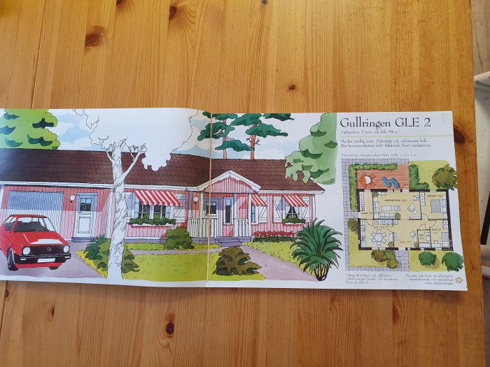 Öppnad byggkatalog visande en illustration av ett rött hus med vita knutar och en planskiss, titeln "Gullringen GLE 2".