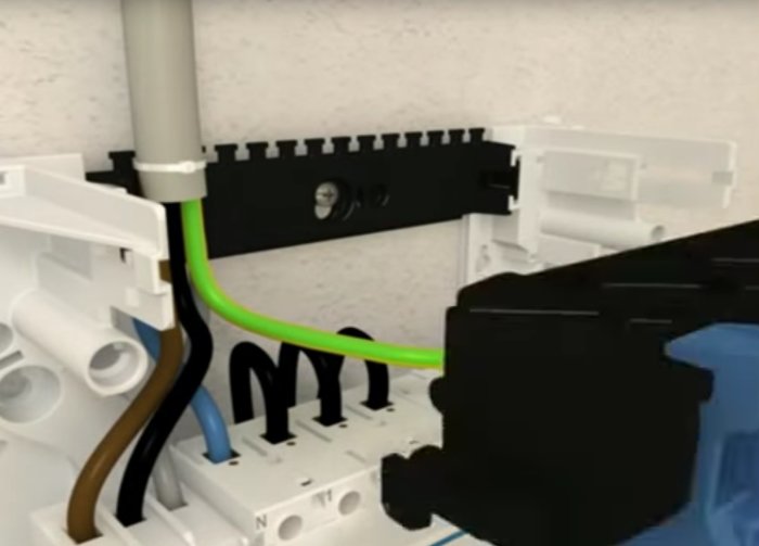 Installation av kablar och rör i en elektrisk central med buntband enligt Hagers instruktionsvideo.