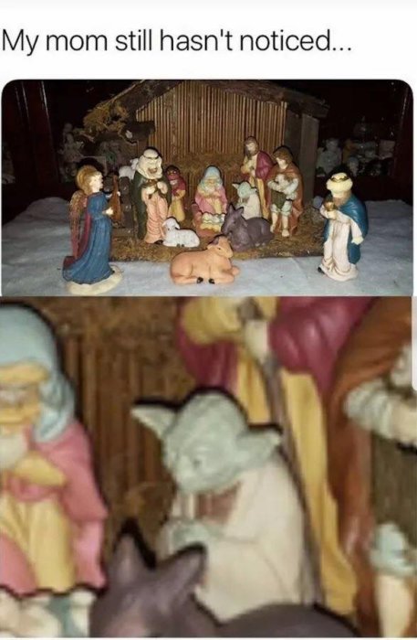 En julkrubba med figurer, där en Yoda-figur har placerats bland de traditionella karaktärerna.