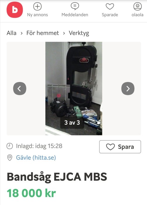 Bandsåg EJCA MBS med tillbehör i oordning på golvet i ett garage.