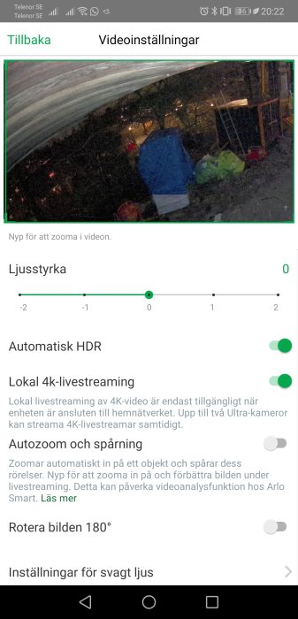 Skärmdump av videoinställningar med ljusstyrka, HDR, 4k-streaming och autozoom-funktioner samt en nattbild av en trädgård.